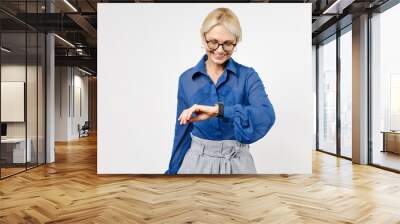 Blonde successful confident employee business woman 40s in blue classic shirt glasses formal clothes look smart watch isolated on white background studio portrait. Achievement career wealth concept Wall mural