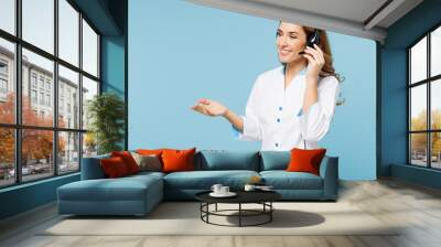 Female fun doctor woman wears white medical gown suit set microphone headset for helpline assistance work in call center hospital clinic isolated on plain blue background Health care medicine concept Wall mural