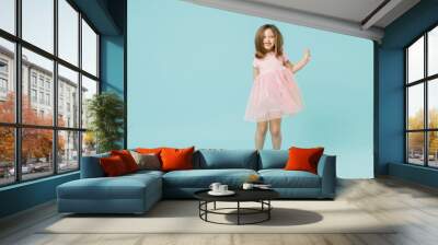 Full size body length little fun cute kid girl 5-6 years old wears pink dress dancing isolated on pastel blue color background child studio portrait. Mother's Day love family people lifestyle concept. Wall mural