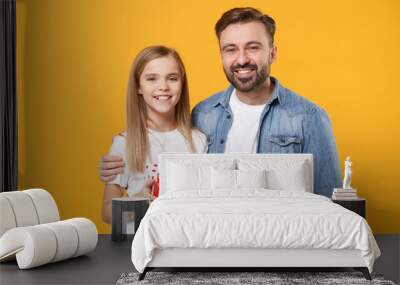 Smiling bearded man have fun with child baby girl. Father little kid daughter isolated on yellow background. Love family day parenthood childhood concept. Hold red present box with gift ribbon bow. Wall mural