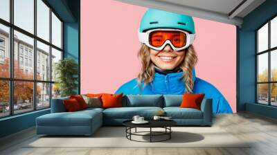 Snowboarder smiling happy fun woman wear blue suit goggles mask hat ski padded jacket helmet look camera isolated on plain pastel pink background Winter extreme sport hobby weekend trip relax concept Wall mural