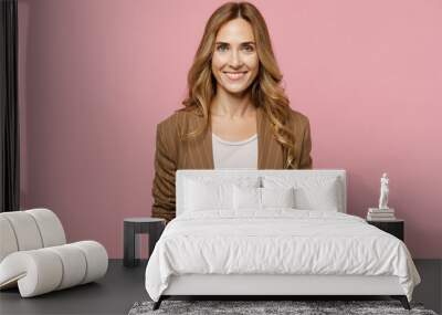 Young satisfied smiling happy fun cheerful successful european employee business woman 30s she wearing casual classic jacket look camera isolated on plain pastel light pink background studio portrait. Wall mural