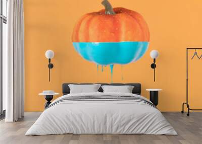 Halloween minimal concept with pumpkin and paint. Creative spooky holiday fun background Wall mural