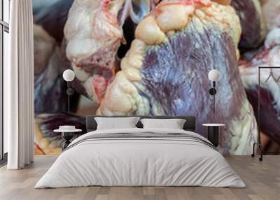 Raw cow hearts on the table. Wall mural