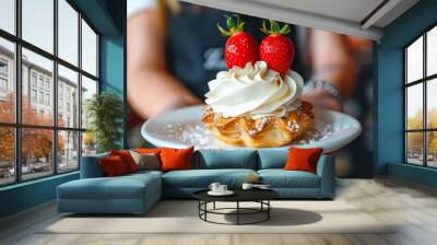 waitress delicately serves a pastry topped with white frosting and two small strawberries Wall mural