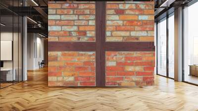 old brick wall with wooden elements. warm colors from sunlight. rough texture of old bricks connecte Wall mural