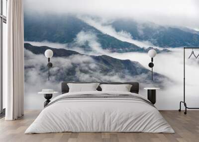 Ta Xua is a famous mountain range in northern Vietnam. All year round, the mountain rises above the clouds creating cloud inversions. Wall mural