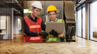 Engineer work with laptop computer in workshop Wall mural