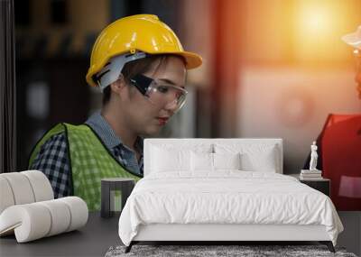 portrait of a engineer. portrait of a worker. beautiful woman engineer close up portrait in front of machine on background. Wall mural