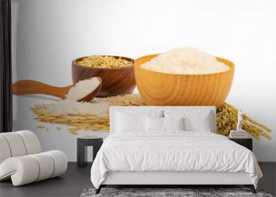 White Jasmine rice in a wooden bowl and wooden spoon and paddy rice and with Ear of rice isolated on white background Wall mural