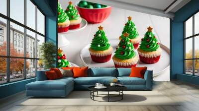 Christmas cupcakes decorated with a Christmas tree on a white plate. Wall mural