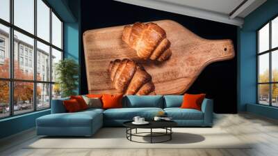 two tasty crispy French croissant.dark background.top view. Wall mural