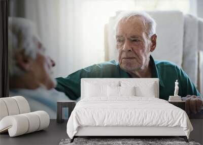 Ill always be by your side. Shot of a senior man visiting his wife in hospital. Wall mural