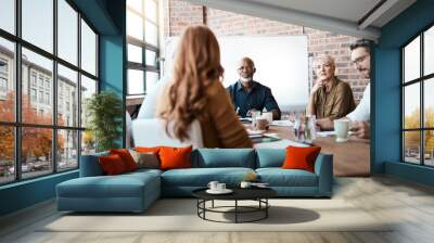 Planning for tomorrows success. Shot of a businessman leading a meeting in the boardroom. Wall mural