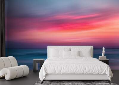 A blurred image of a beautiful sunset over the ocean with warm colors Wall mural