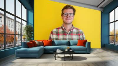 A person wearing glasses and a plaid shirt Wall mural