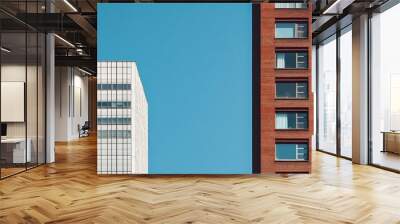 Two high-rise buildings standing side by side, suitable for cityscape or architecture images Wall mural