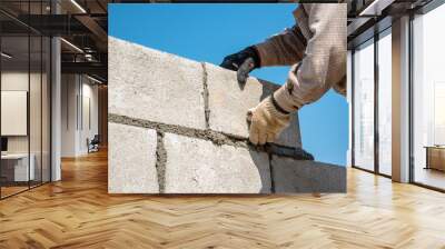 worker build concrete wall by cement block and plaster  Wall mural