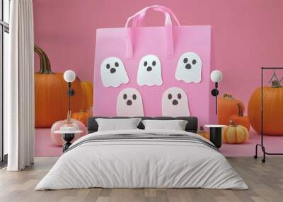 A cute Halloween candy bag concept featuring ghosts and pumpkins decorated in pastel colors with copy space to add text Wall mural