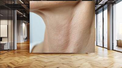 A woman's aging neck is embellished with wrinkles, skin folds, or creases. Wall mural