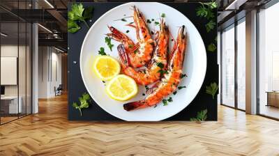 An elegant white plate is adorned with grilled prawns, herbs, and lemon slices. Wall mural