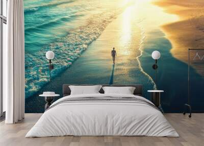 In this peaceful scene, a serene figure walks along a golden sand beach. The waves gently lap against the shore. This peaceful scene evokes tranquility and a sense of connection to the natural world. Wall mural