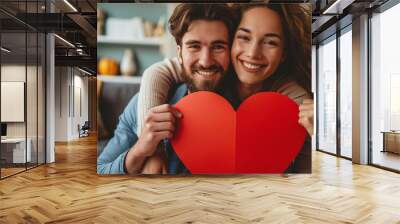 Couple in love holding big red heart and smiling.	 Wall mural