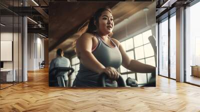 Obesity woman in the gym working on losing weight.  Wall mural