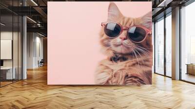 A close-up portrait of a funny cat wearing stylish sunglasses, isolated on a light pink background Wall mural