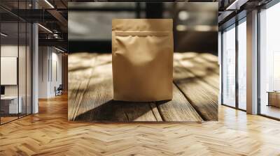 A mockup image of a craft paper standing pouch with a natural brown texture, positioned on a rustic wooden table Wall mural