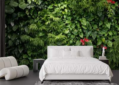 Green wall of different deciduous plants in the interior decoration. plant decorate on wall. Wall mural