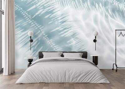 Tropical leaf shadow on water surface. Shadow of palm leaves on white sand beach. Beautiful abstract background concept banner for summer vacation at the beach. Wall mural