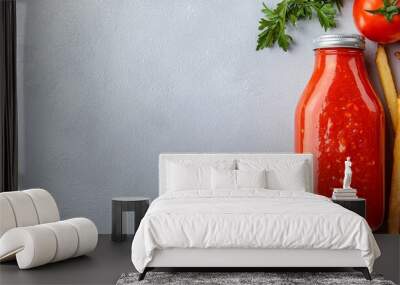  A bottle of ketchup next to French fries and tomatoes, garnished with parsley Wall mural