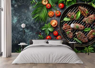  A grill topped with meat and vegetables, adjacent to a table laden with a cluster of green leaves and tomatoes Wall mural