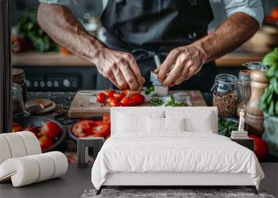  A man in a chef's uniform chops tomatoes on a cutting board Nearby, several bowls of vegetables await preparation Wall mural