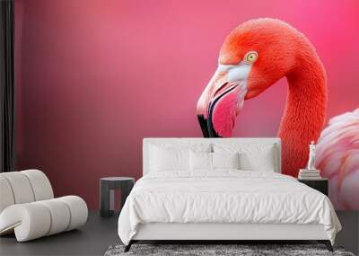  A pink flamingo in focus against a softly blurred background, featuring a pink sky Wall mural