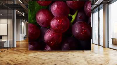  A tight shot of grapes with dewdrops and a verdant leaf above Wall mural