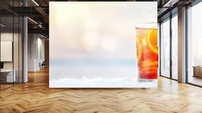 1 An orange slice,.2 Another orange slice garnished with cinnamon,.3 And a star anise Wall mural