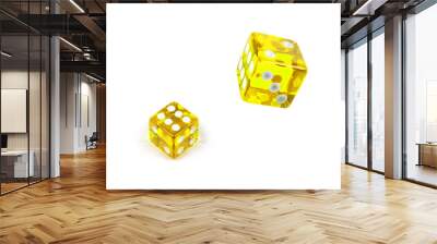 Two yellow glass dices isolated on white. Six and flying in the air, view from above. Wall mural