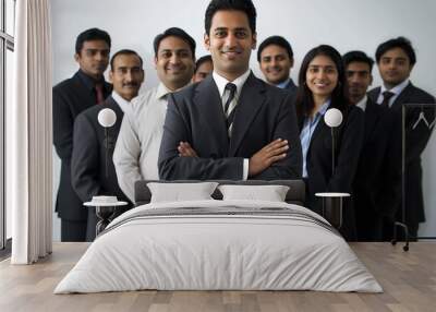 Group of 9 professionals in business attire stand together in line against white background. 6 wear suits, 3 wear ties. Unity and purpose in their stance. Wall mural