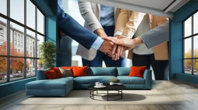 Group of adults standing together at office. Hands clasped, business professionals unity, cooperation. Colleagues in meeting, discussing agreements, ideas. Man, woman colleagues in pro attire, Wall mural