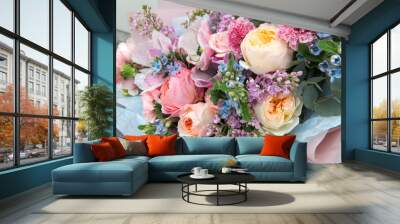 Beautiful rich elegant wedding pink bouquet, flowers arrangement by florist with roses, lilac and blue flowers. Floral background Wall mural