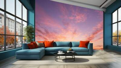 Soft sunrise, sunset pink violet orange sky with sun, clouds background texture Wall mural