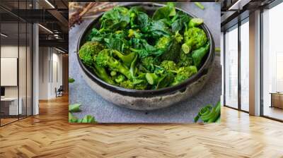 Green cooked steamed broccoli, spinach salad meal. Vegan healthy diet food. Wall mural