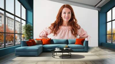 Caucasian woman model with ginger hair posing indoors Wall mural