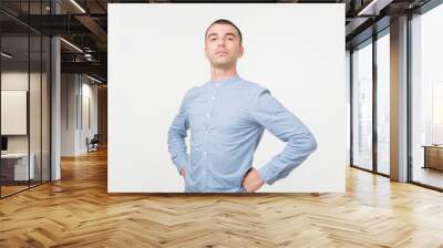 Handsome young man standing like a super hero Wall mural