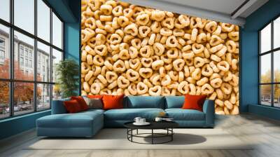 Background of whole grain oat cereal in a heart shape. Top view, close up. Heart shapes cereal.  Wall mural