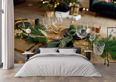 Table served for Christmas dinner in living room, close-up view, table setting, Christmas decoration. Wall mural