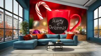 Red ceramic cup with Merry Christmas sign made with chalk. Wall mural