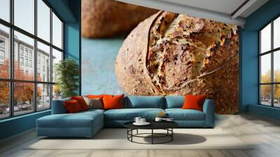 Homemade Freshly Baked Country Bread  made from wheat and whole grain flour on a dark background. French Freshly baked bread.  Wall mural